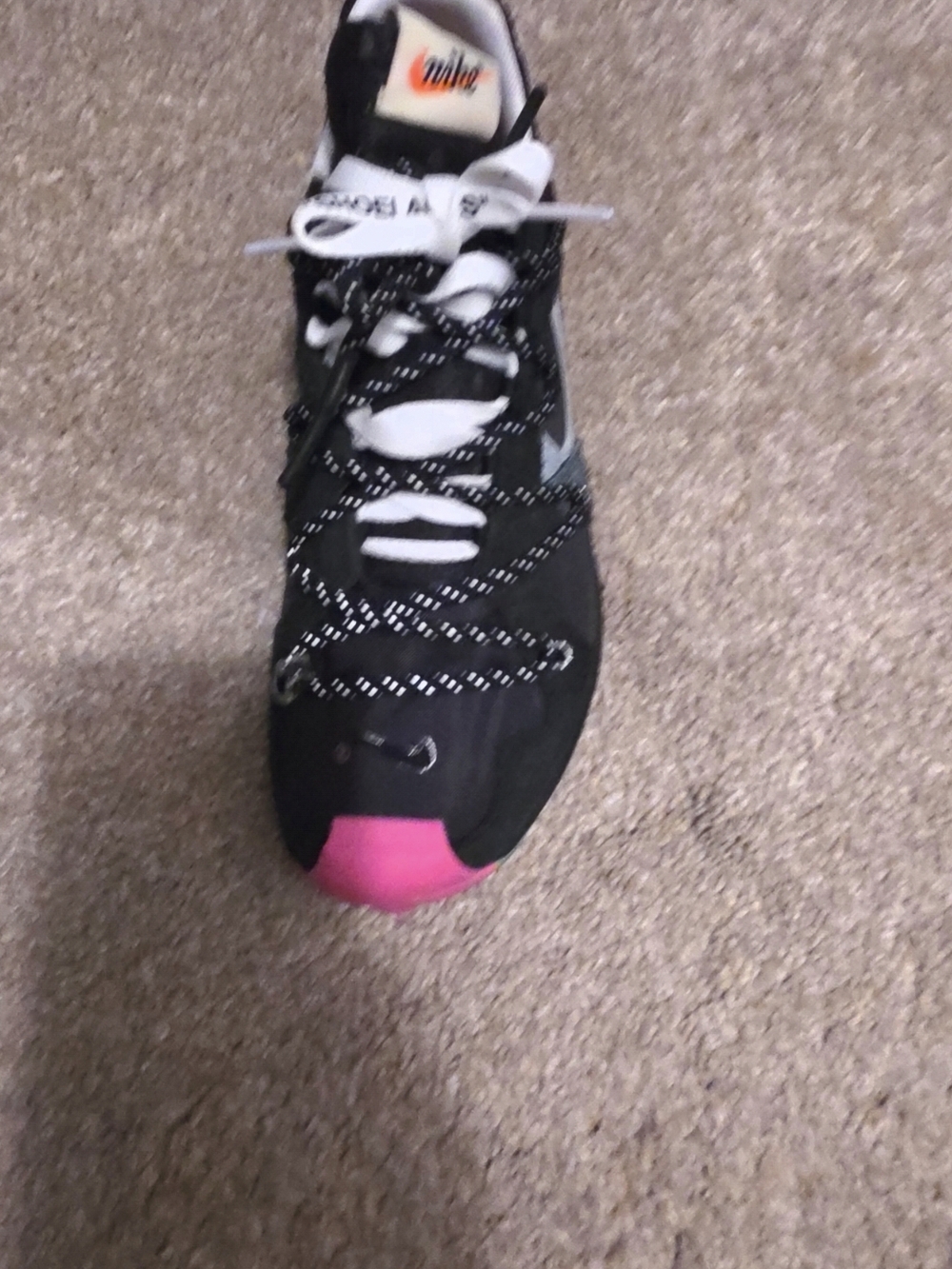 Nike Women’s Black Sneaker with Pink Toe Accent